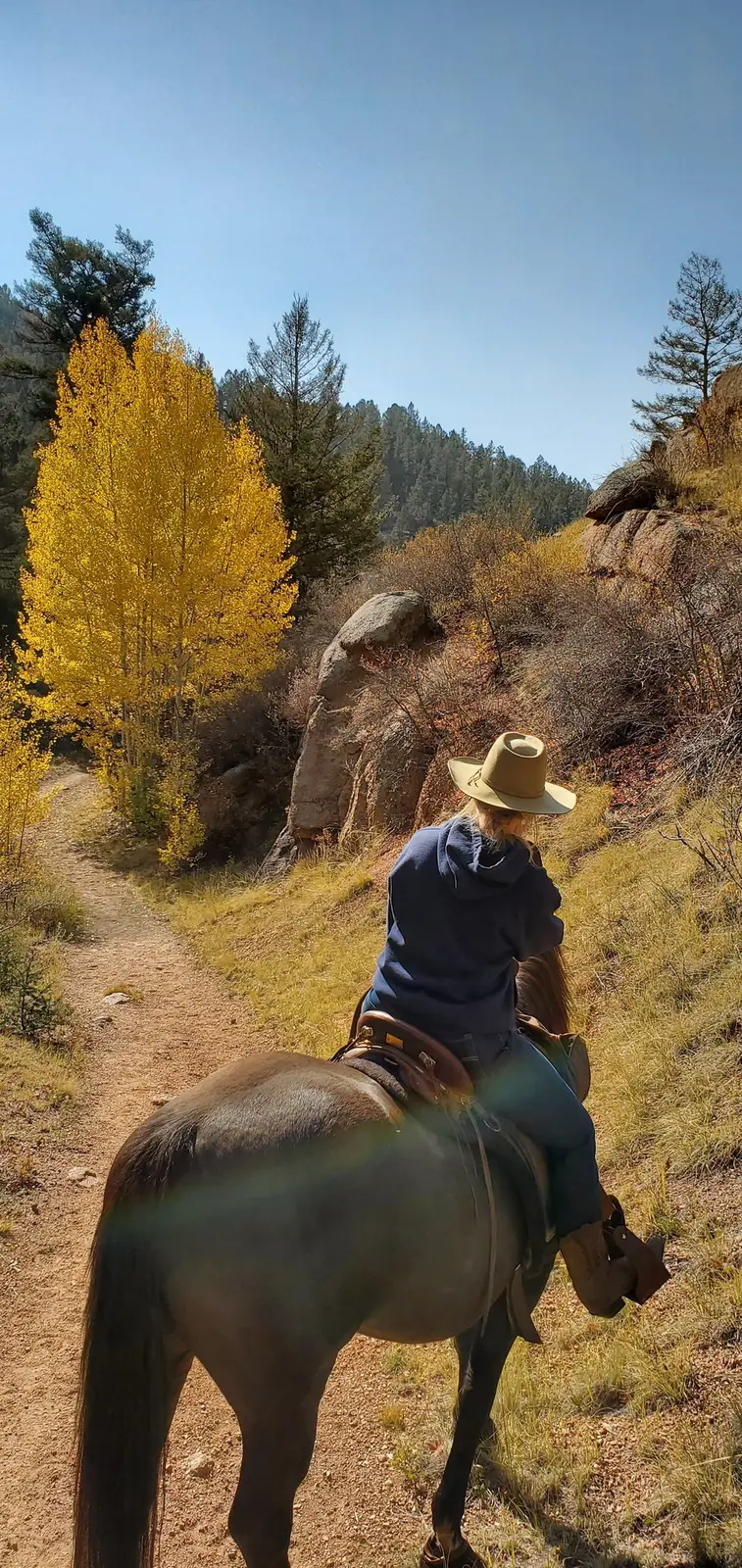 An autumn ranch ride through rocky Colorado country.