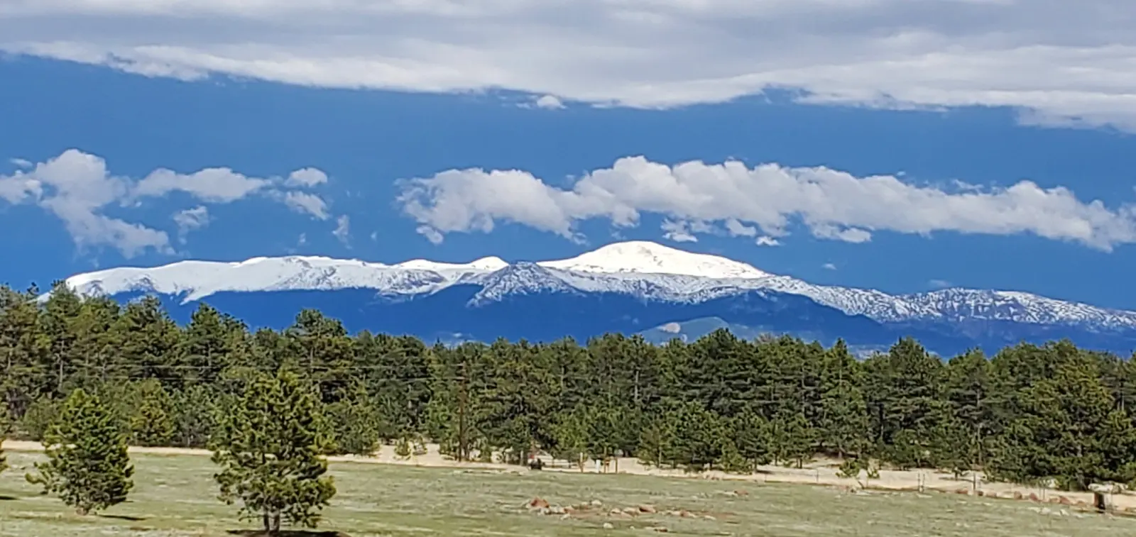 Snow-capped peaks beyond the ranch.